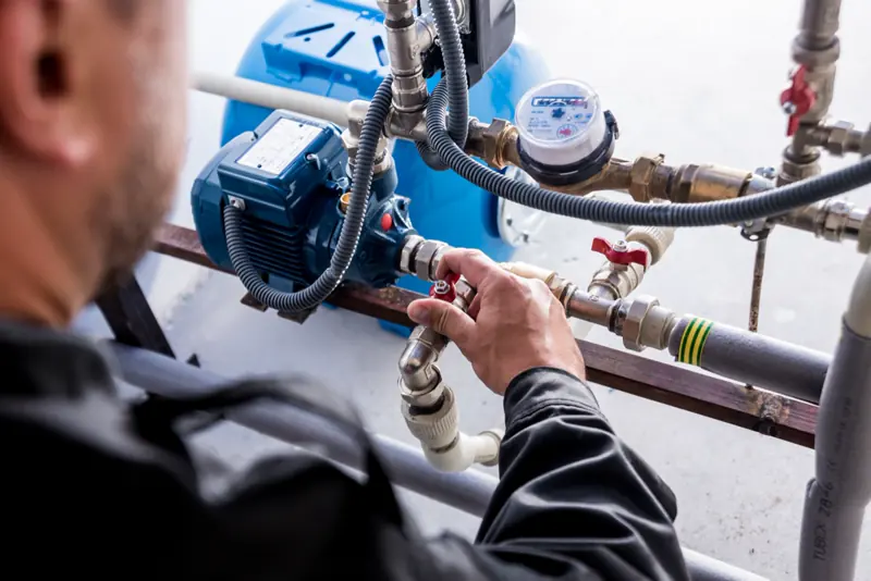 Technician servicing a water treatment system