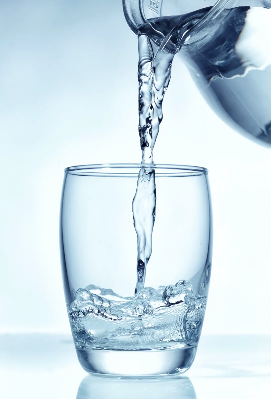 Close-up of water rippling in a glass, showing what can be dissolved in tri-state tap water
